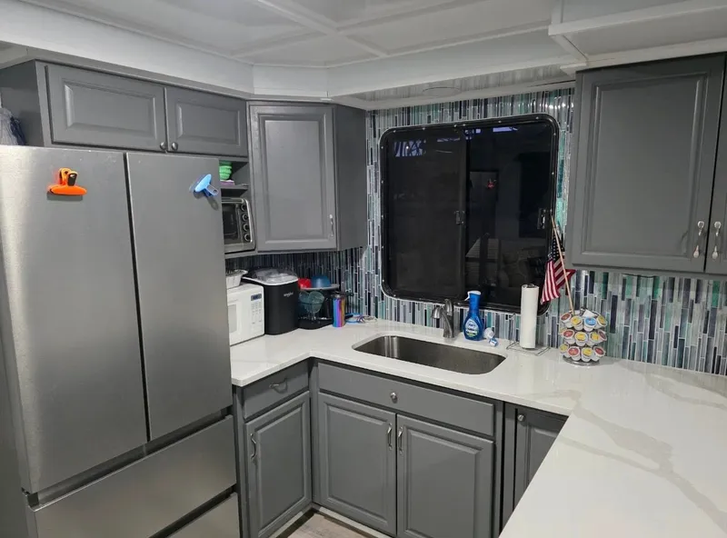 Slide: The Image of Modern kitchen with gray cabinets and stainless steel appliances, STARDUST 53, 1992. - 40