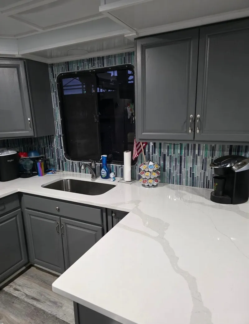 Slide: The Image of Modern kitchen with gray cabinets and mosaic tiles, STARDUST 53, year 1992. - 43