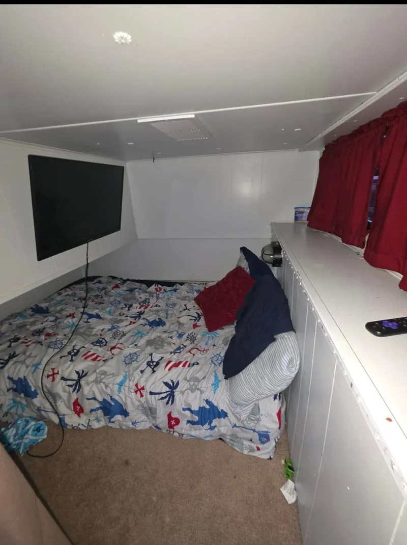 Slide: The Image of Cozy bedroom in 1992 STARDUST 53 with TV and colorful bedding. - 49