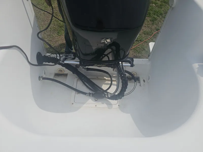 Slide: The Image of Engine area of a 1999 Pro-Line 200 Sportsman boat. - 14