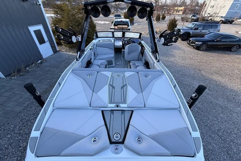 Slide: The Image of 2026 Centurion Nv233 boat with sleek interior design and advanced audio system. - 13