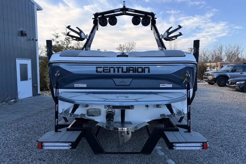 Slide: The Image of 2026 Centurion Nv233 boat rear view with speakers and swim platform. - 4