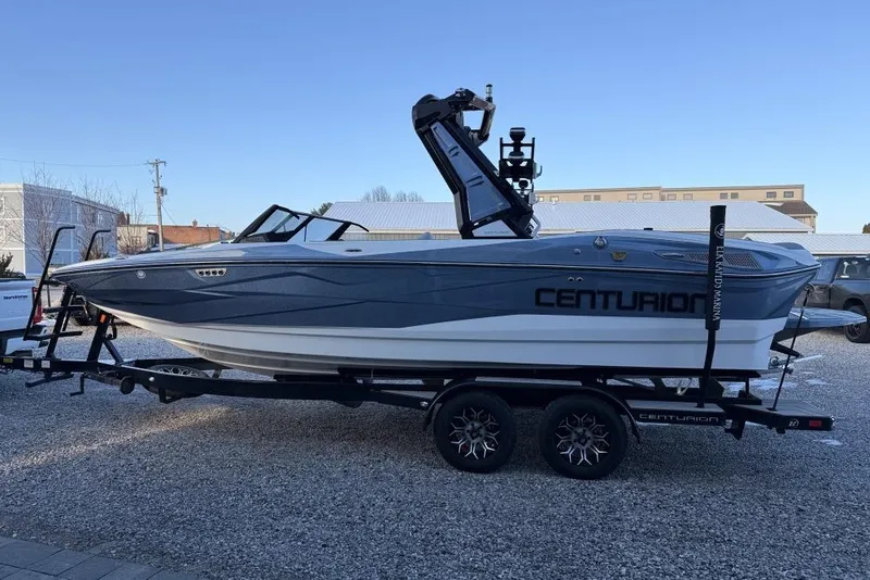 Slide: The Image of 2026 Centurion Nv233 boat on trailer in outdoor setting. - 6