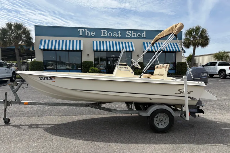 The Image of 2011 Scout 160 Sportfish boat on trailer outside The Boat Shed. - 0
