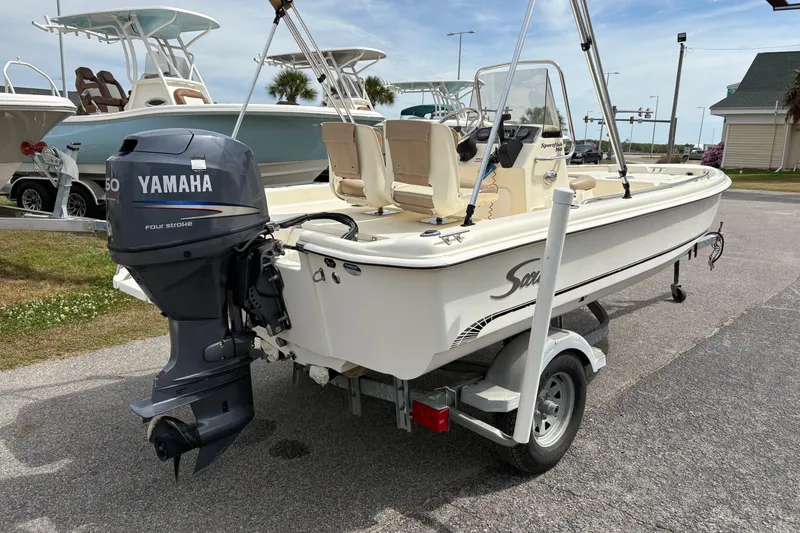 Slide: The Image of 2011 Scout 160 Sportfish boat with Yamaha outboard motor on trailer. - 3