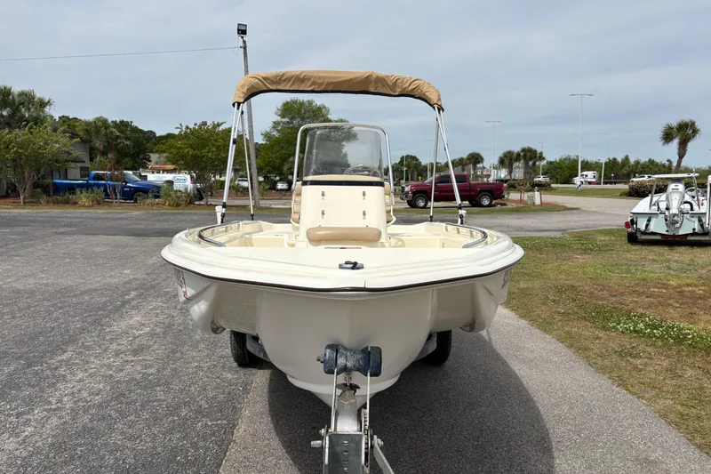 Slide: The Image of 2011 Scout 160 Sportfish boat on trailer, parked outdoors. - 6