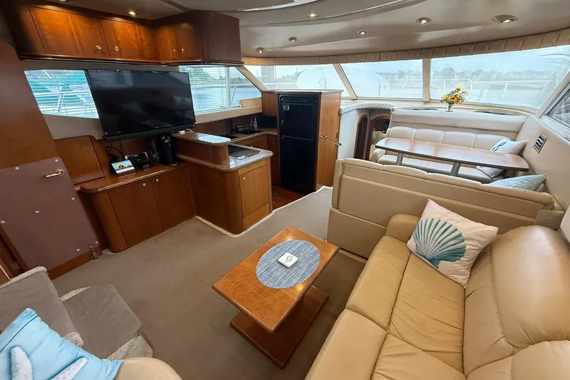 Slide: The Image of Luxurious interior of 2001 Cruisers Yachts 4450 Express Motoryacht with plush seating and modern amenities. - 11