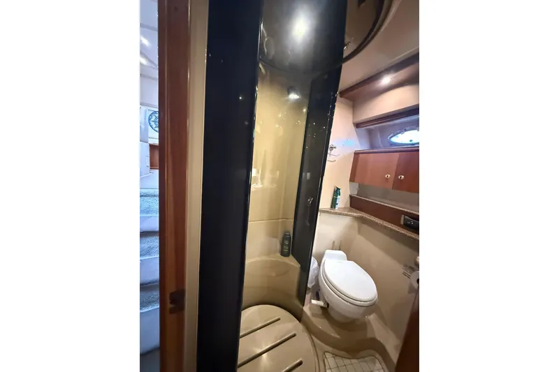 Slide: The Image of Bathroom interior of 2001 Cruisers Yachts 4450 Express Motoryacht with shower and toilet. - 17