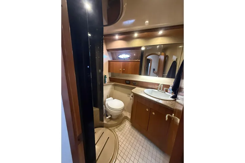 Slide: The Image of Luxurious bathroom in 2001 Cruisers Yachts 4450 Express Motoryacht with modern fixtures. - 18