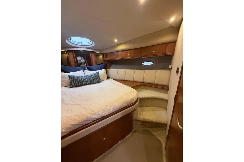 Slide: The Image of Luxurious bedroom interior of 2001 Cruisers Yachts 4450 Express Motoryacht with plush bedding. - 20