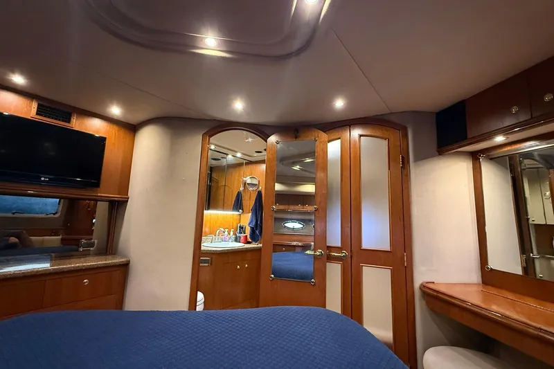 Slide: The Image of Luxurious interior of 2001 Cruisers Yachts 4450 Express Motoryacht with elegant wood finishes. - 23