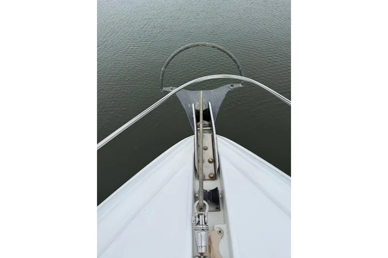 Slide: The Image of Bow view of 2001 Cruisers Yachts 4450 Express Motoryacht on calm water. - 29