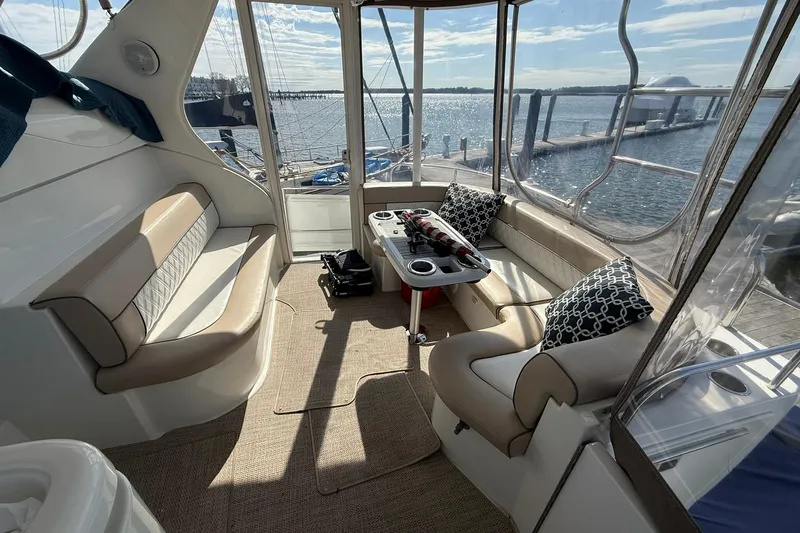 Slide: The Image of Luxurious interior of 2001 Cruisers Yachts 4450 Express Motoryacht with waterfront view. - 3