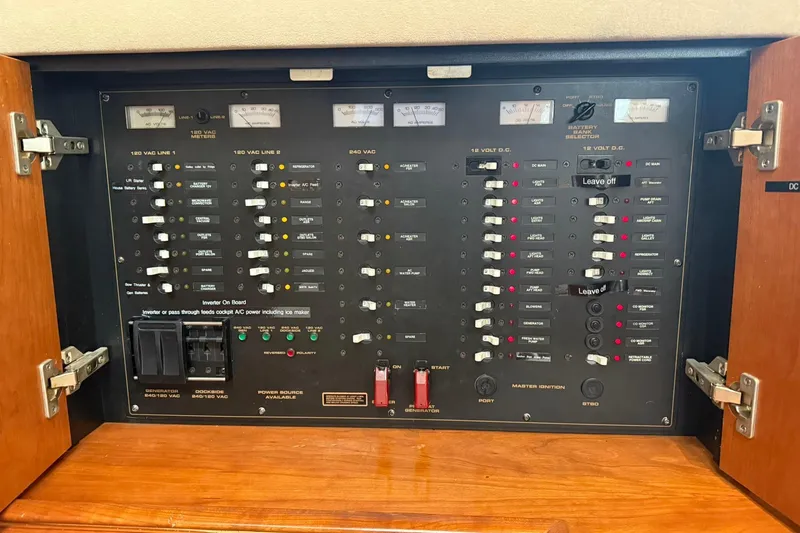 Slide: The Image of Electrical control panel of 2001 Cruisers Yachts 4450 Express Motoryacht, featuring switches and meters. - 30