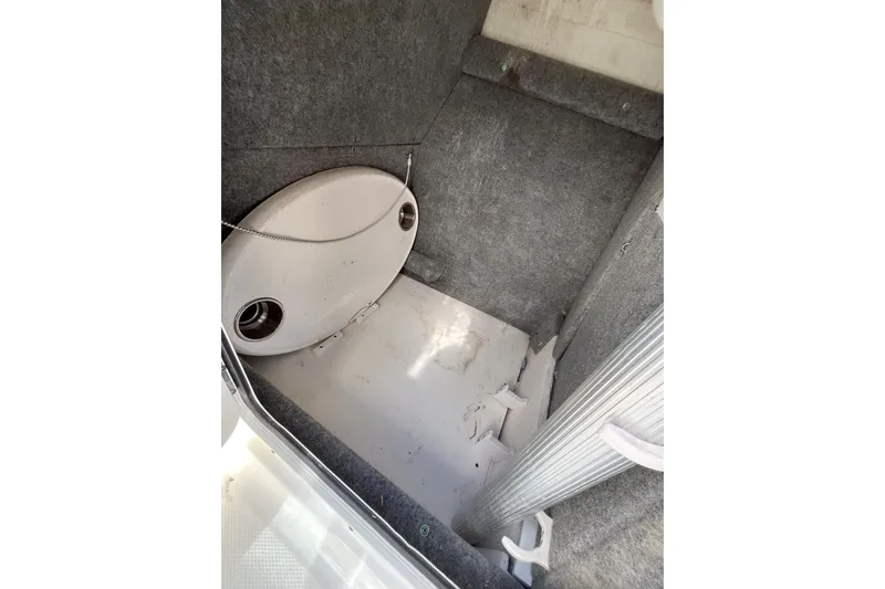 Slide: The Image of Interior view of 2014 Robalo R247 Dual Console boat storage compartment. - 9