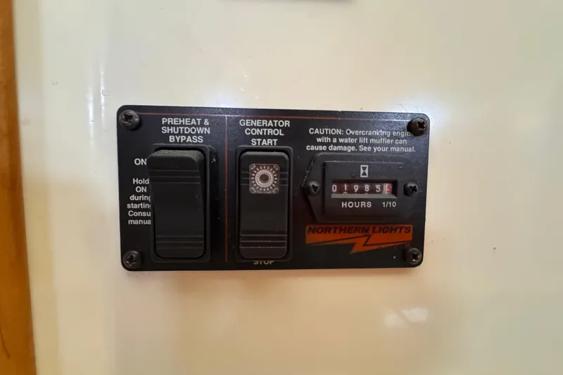 Slide: The Image of Control panel of a 2006 PDQ PowerCat with generator hour meter reading 1985.5 hours. - 12