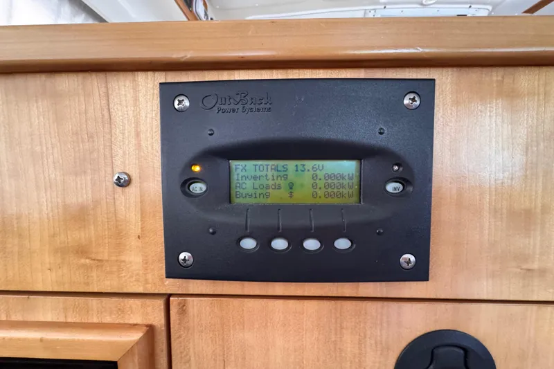 Slide: The Image of OutBack Power Systems display on 2006 PDQ PowerCat, showing voltage and power metrics. - 15