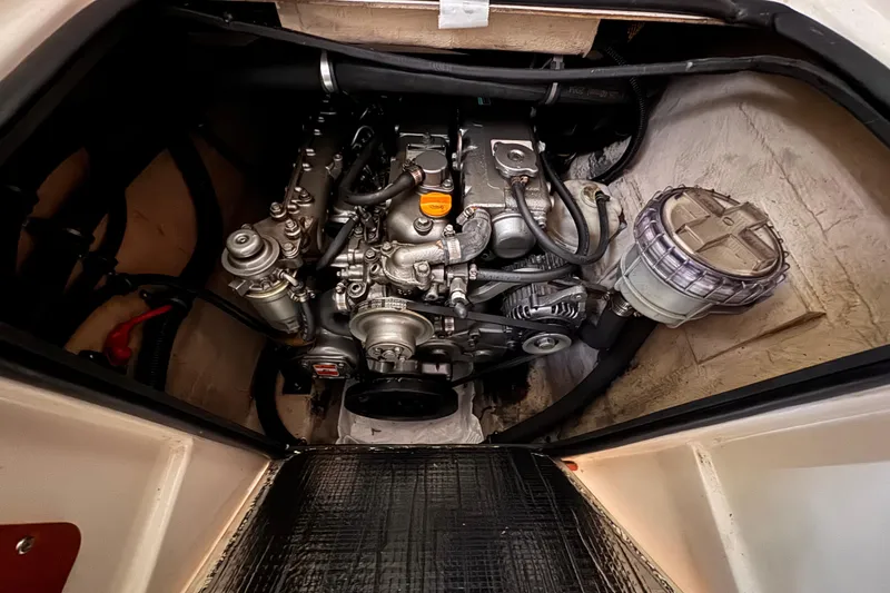 Slide: The Image of Engine compartment of a 2006 PDQ PowerCat boat, showcasing mechanical components. - 20