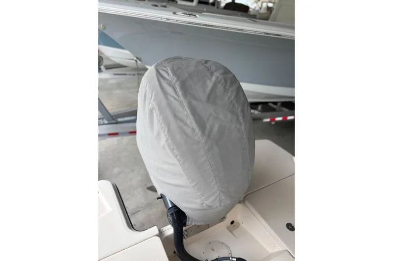Slide: The Image of Covered outboard motor on a 2022 Grady-White Freedom 235 boat. - 10