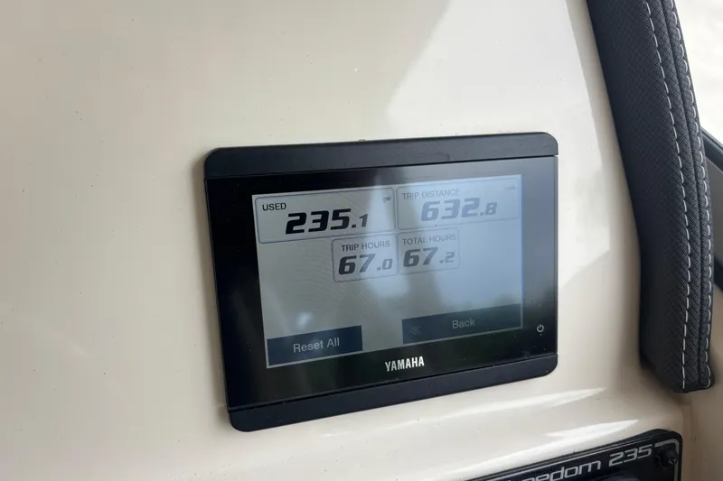 Slide: The Image of Yamaha display on 2022 Grady-White Freedom 235 showing trip data and hours. - 23