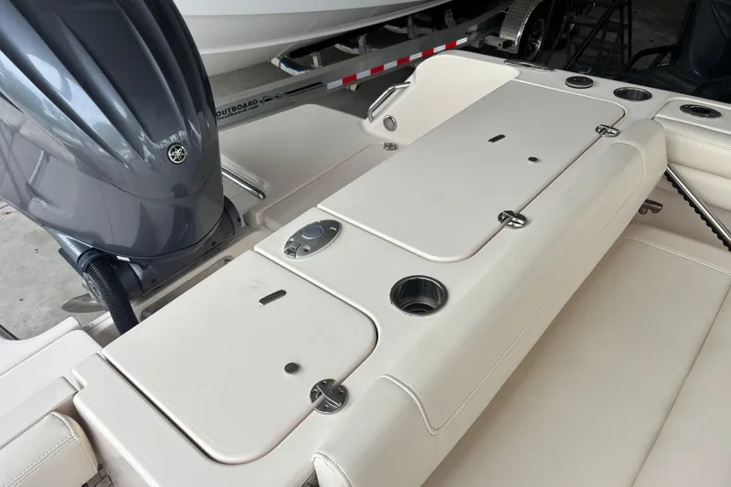 Slide: The Image of 2022 Grady-White Freedom 235 boat interior with Yamaha outboard motor. - 25