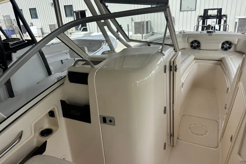 Slide: The Image of 2022 Grady-White Freedom 235 boat interior with seating and storage compartments. - 34