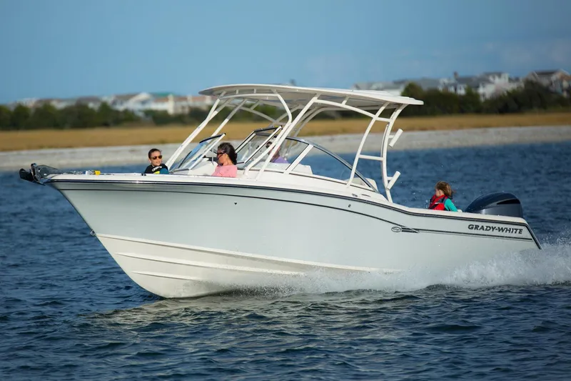 Slide: The Image of Manufacturer Provided Image: 2022 Grady-White Freedom 235 boat cruising on water with passengers. - 8