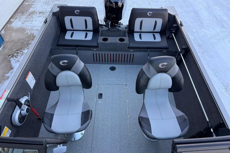 Slide: The Image of 2026 Crestliner 1650 Kodiak boat interior with four seats, gray and black design. - 11