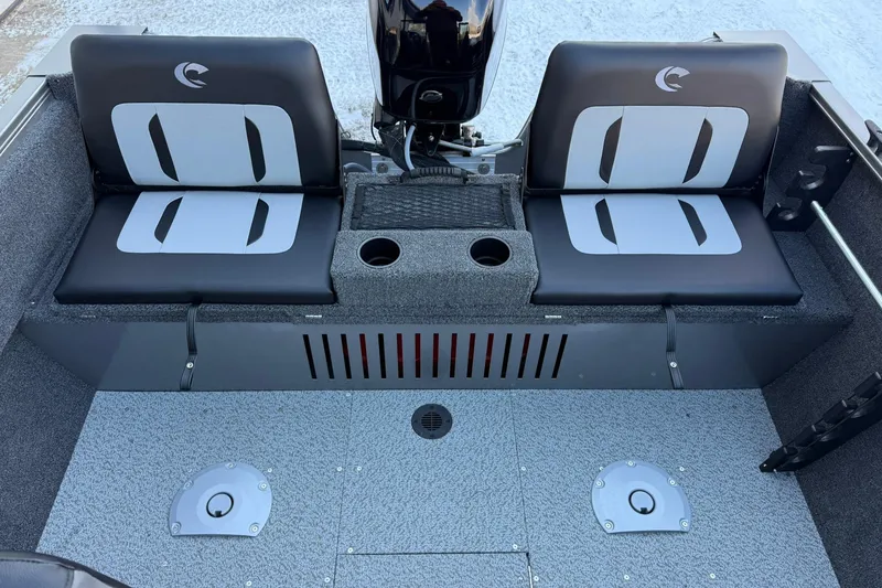 Slide: The Image of 2026 Crestliner 1650 Kodiak boat interior with dual seats and motor. - 12