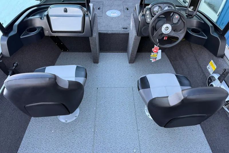 Slide: The Image of Interior of 2026 Crestliner 1650 Kodiak boat with dual seats and steering console. - 15