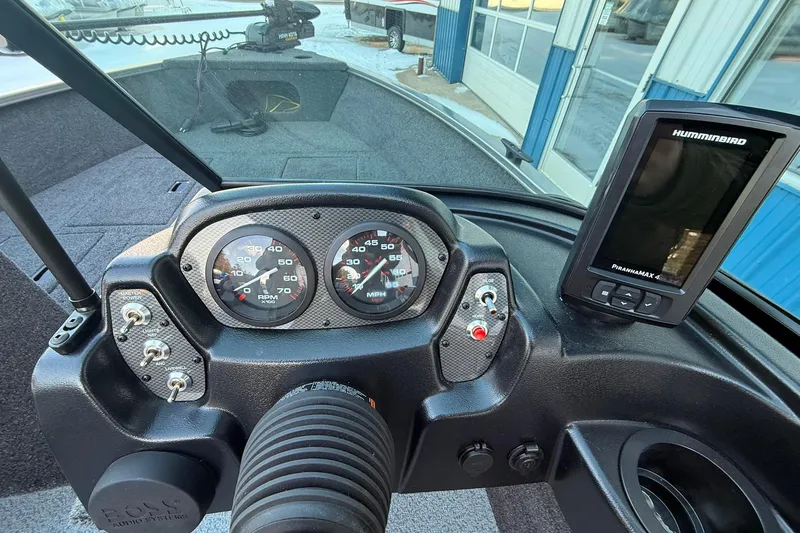 Slide: The Image of Dashboard of 2026 Crestliner 1650 Kodiak boat with gauges and Humminbird electronics. - 16