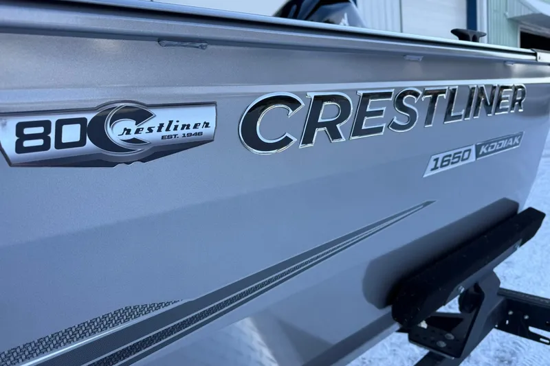 Slide: The Image of 2026 Crestliner 1650 Kodiak boat side view with logo and model details. - 7
