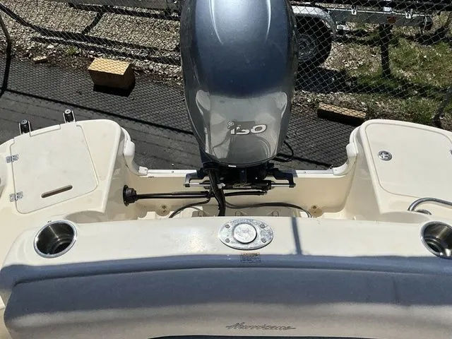 Slide: The Image of Rear view of a 2008 Hurricane SunDeck 2000 with outboard motor. - 10
