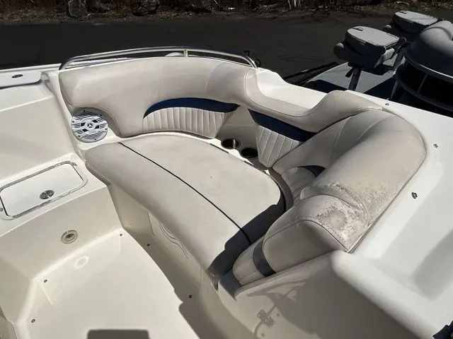 Slide: The Image of 2008 Hurricane SunDeck 2000 boat seating with white upholstery. - 17