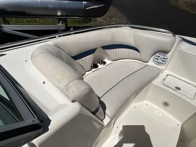 Slide: The Image of Interior of a 2008 Hurricane SunDeck 2000 boat with white seating. - 18