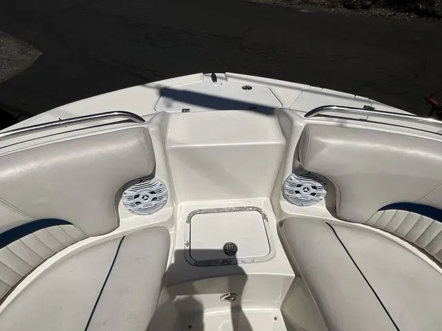 Slide: The Image of Interior view of a 2008 Hurricane SunDeck 2000 boat with white seating. - 19