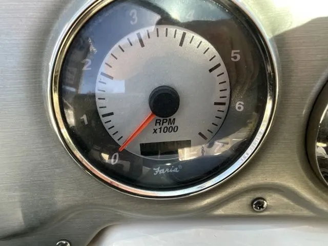 Slide: The Image of Tachometer of a 2008 Hurricane SunDeck 2000 boat, displaying RPM. - 22