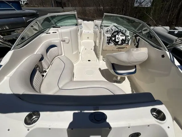 Slide: The Image of Interior of a 2008 Hurricane SunDeck 2000 boat with steering wheel and seating. - 8