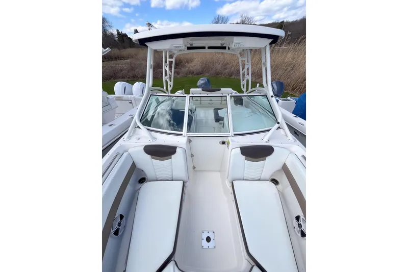 Slide: The Image of 2020 Robalo R247 Dual Console boat with spacious seating and sleek design. - 14