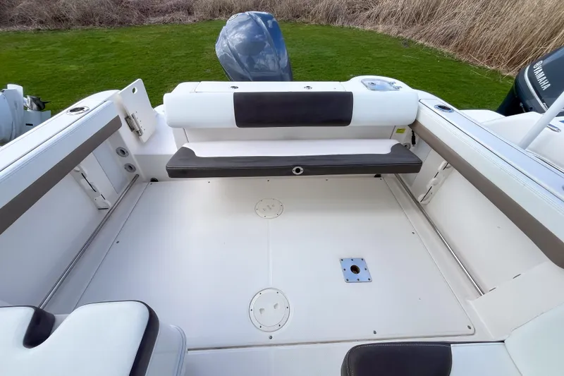Slide: The Image of 2020 Robalo R247 Dual Console boat interior with seating and outboard motor. - 3