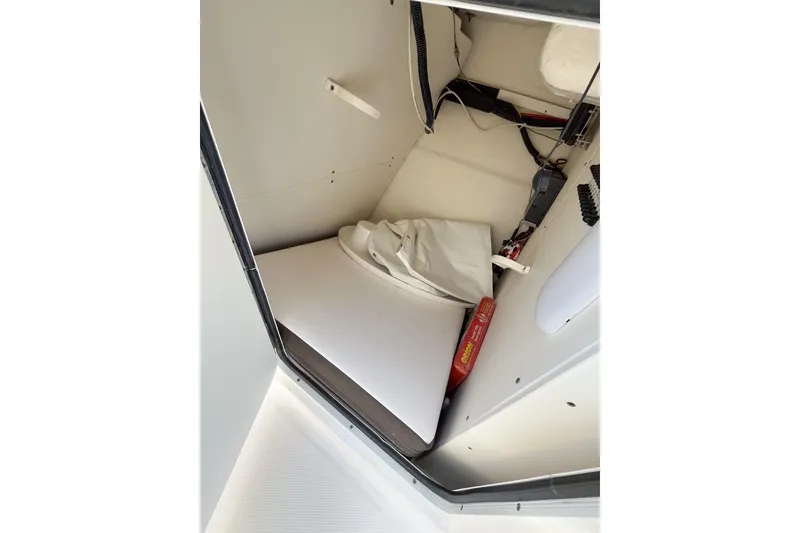 Slide: The Image of Interior storage compartment of 2020 Robalo R247 Dual Console boat. - 8