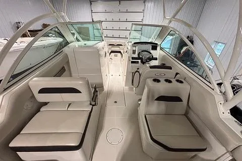 Slide: The Image of 2022 Sailfish 245 DC boat interior with seating and helm, showcasing modern design and functionality. - 14