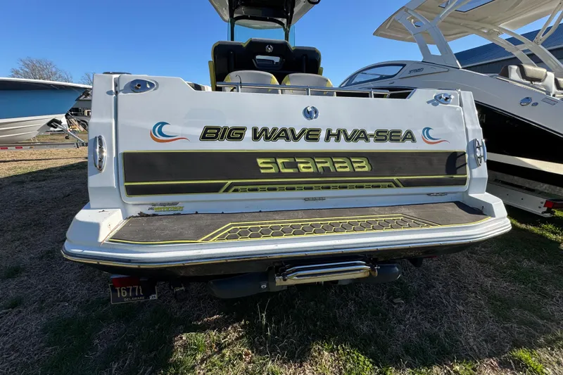 Slide: The Image of 2022 Scarab 255 Open ID boat with "Big Wave HVA-SEA" branding on the stern. - 15