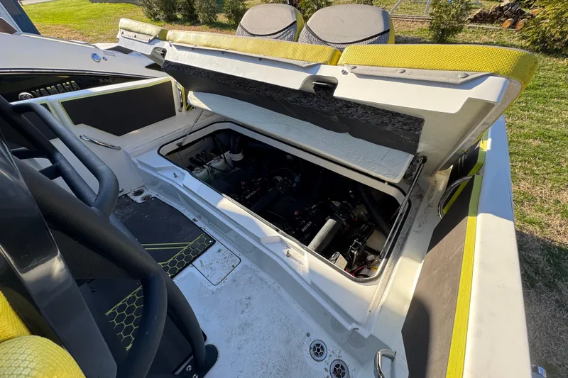 Slide: The Image of Open engine compartment of 2022 Scarab 255 Open ID boat, showcasing interior details. - 3