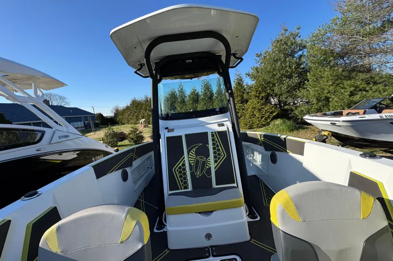 Slide: The Image of 2022 Scarab 255 Open ID boat interior with modern seating and sleek design. - 9