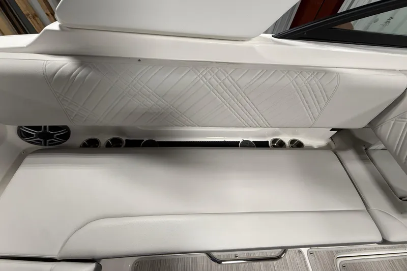 Slide: The Image of Interior seating of 2026 Sea Ray SDX 270 boat with elegant white upholstery. - 13