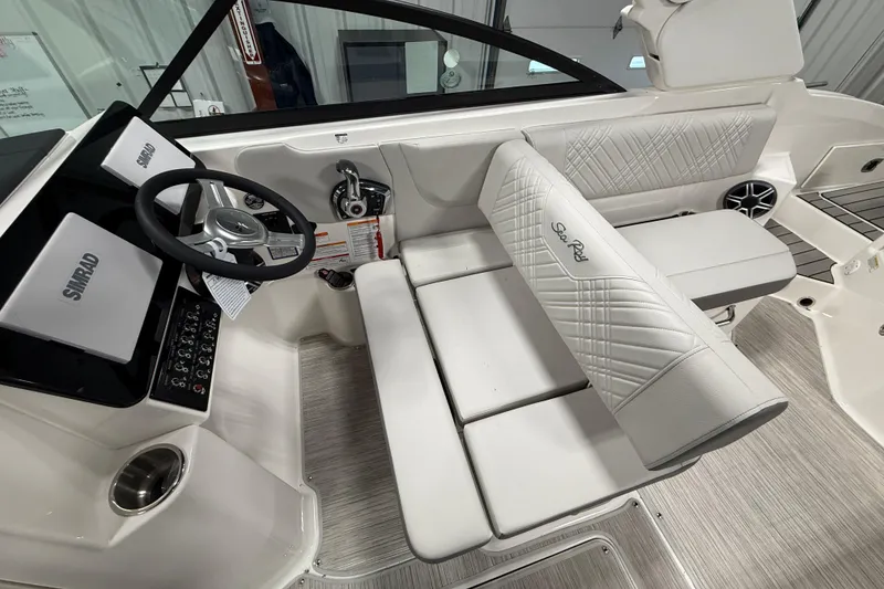 Slide: The Image of Interior of 2026 Sea Ray SDX 270 boat with steering wheel and seating. - 17