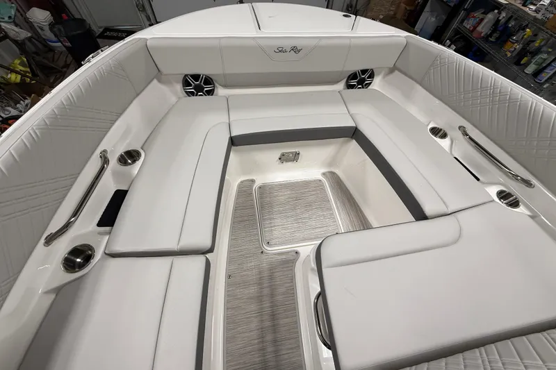 Slide: The Image of Luxurious seating area on a 2026 Sea Ray SDX 270 boat, featuring elegant white upholstery. - 24