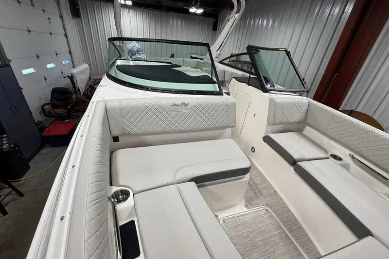 Slide: The Image of 2026 Sea Ray SDX 270 boat interior with white seating and modern design. - 27