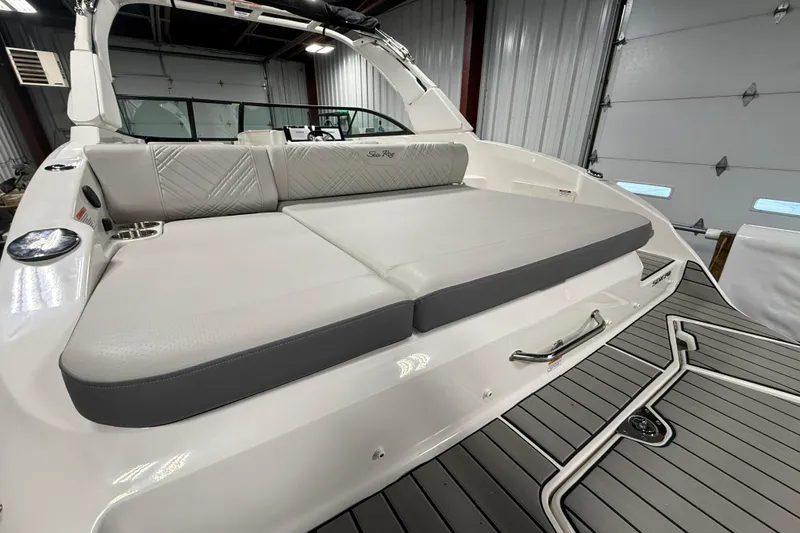 Slide: The Image of 2026 Sea Ray SDX 270 boat interior with cushioned seating and sleek design. - 6